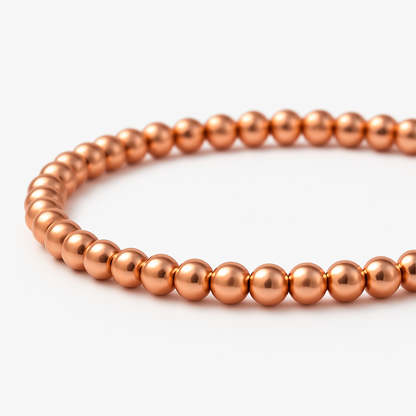 Uniformly sized, polished spherical metal beads strung onto a durable, flexible elastic stretch cord for an easy slip-on fit